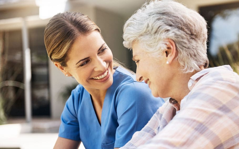 feel-the-difference-at-charter-senior-living senior lady with caregiver outside