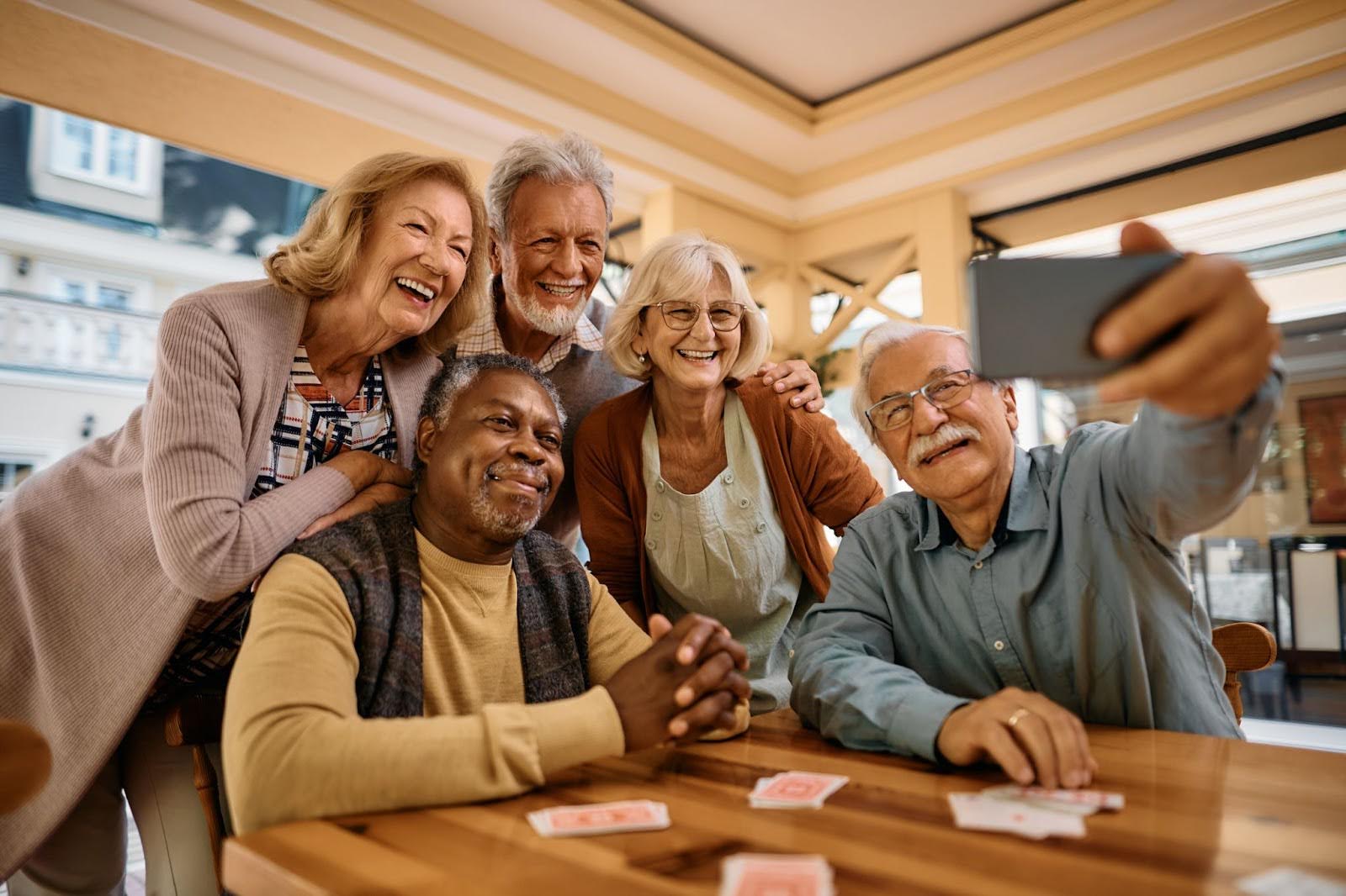 Group of seniors smiling while taking a selfie at Charter Senior Living of Jefferson City, TN.